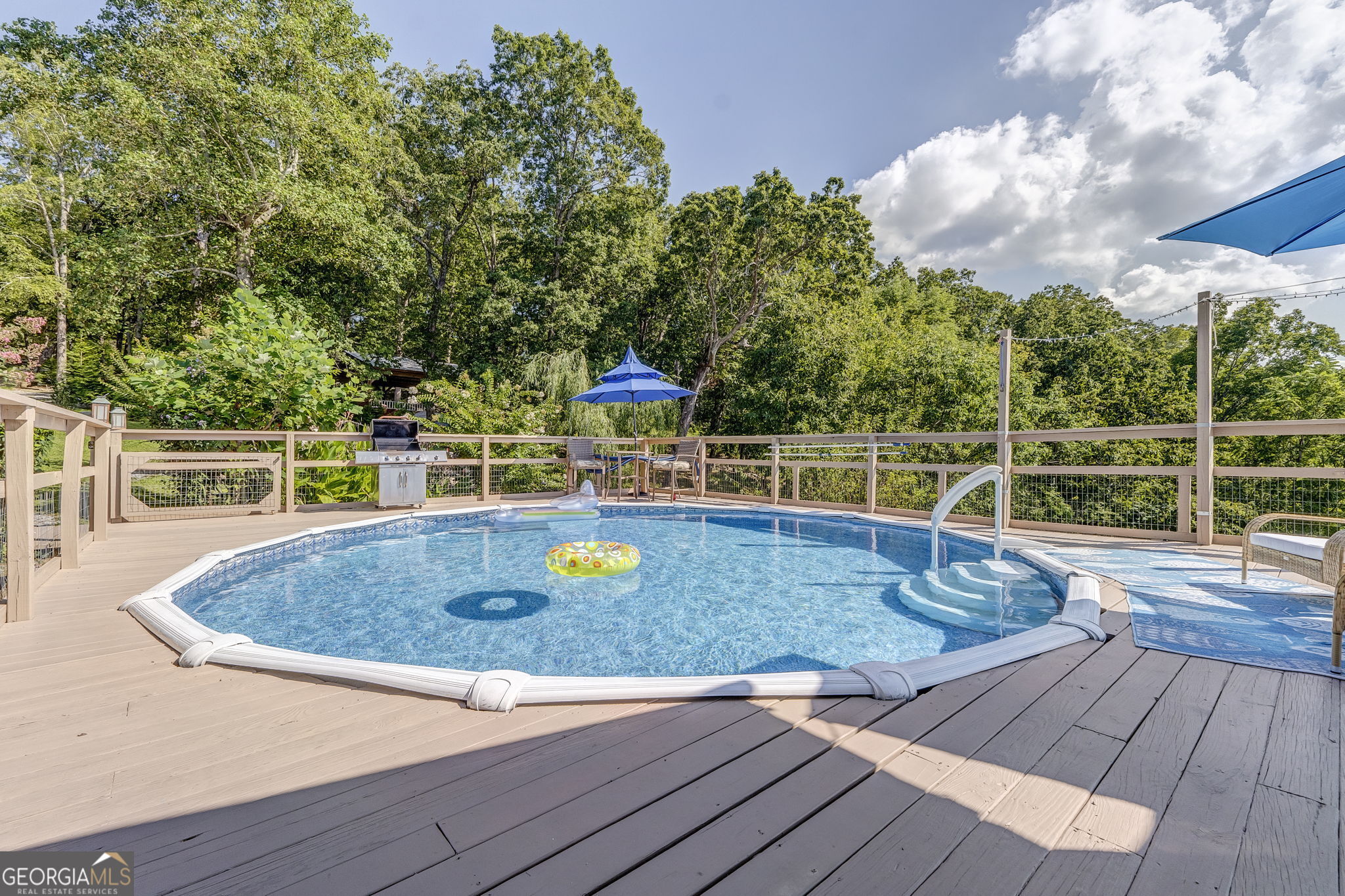 7896 Old State Road Menlo, GA 30731 - Photo 67 of 79 a view of a swimming pool with a patio