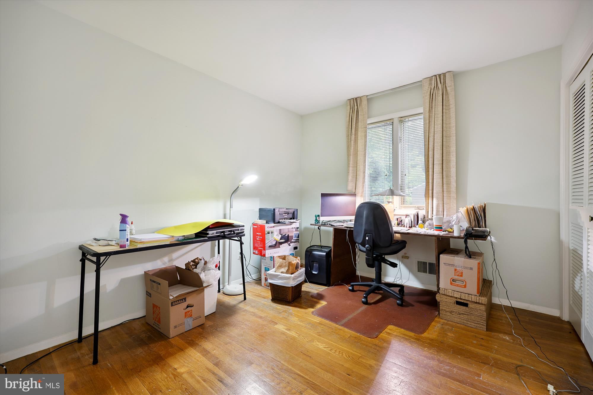 10205 Capitol View Avenue Silver Spring, MD 20910 - Photo 11 of 27 a view of a workspace with furniture and a window