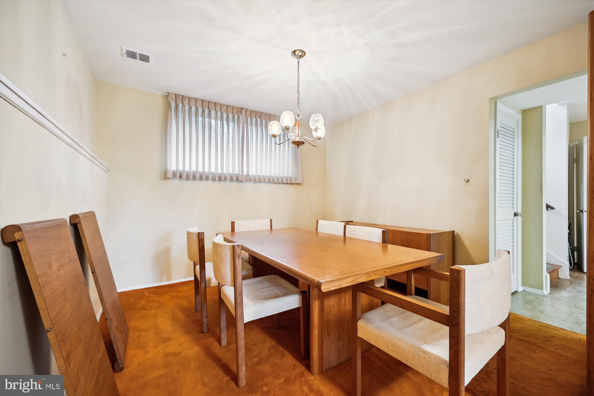 10205 Capitol View Avenue Silver Spring, MD 20910 - Photo 15 of 27 a view of a dining room with furniture and wooden floor
