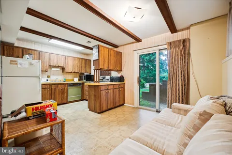 a kitchen with a refrigerator and a sink