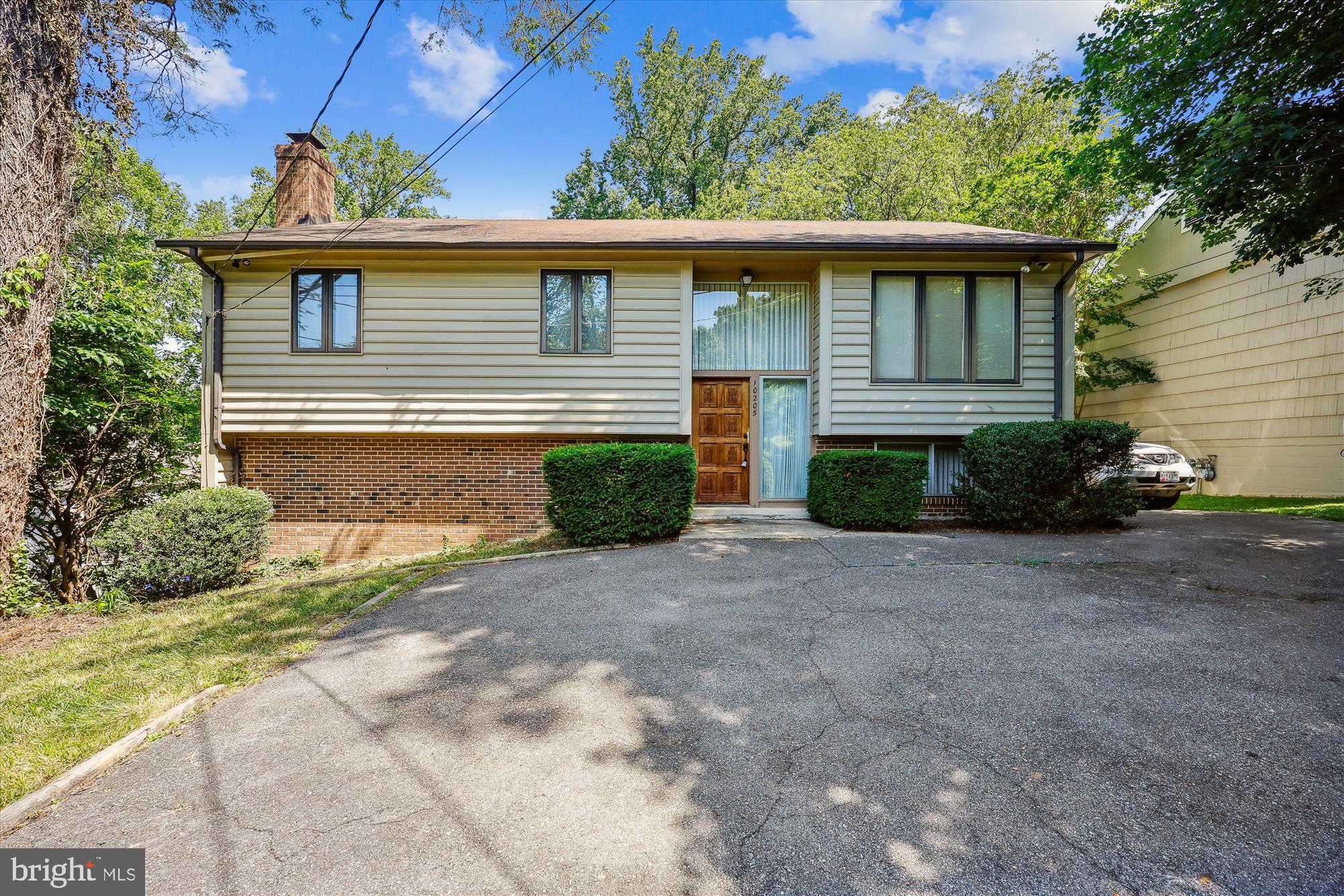 10205 Capitol View Avenue Silver Spring, MD 20910 - Photo 2 of 27 a front view of a house with garden
