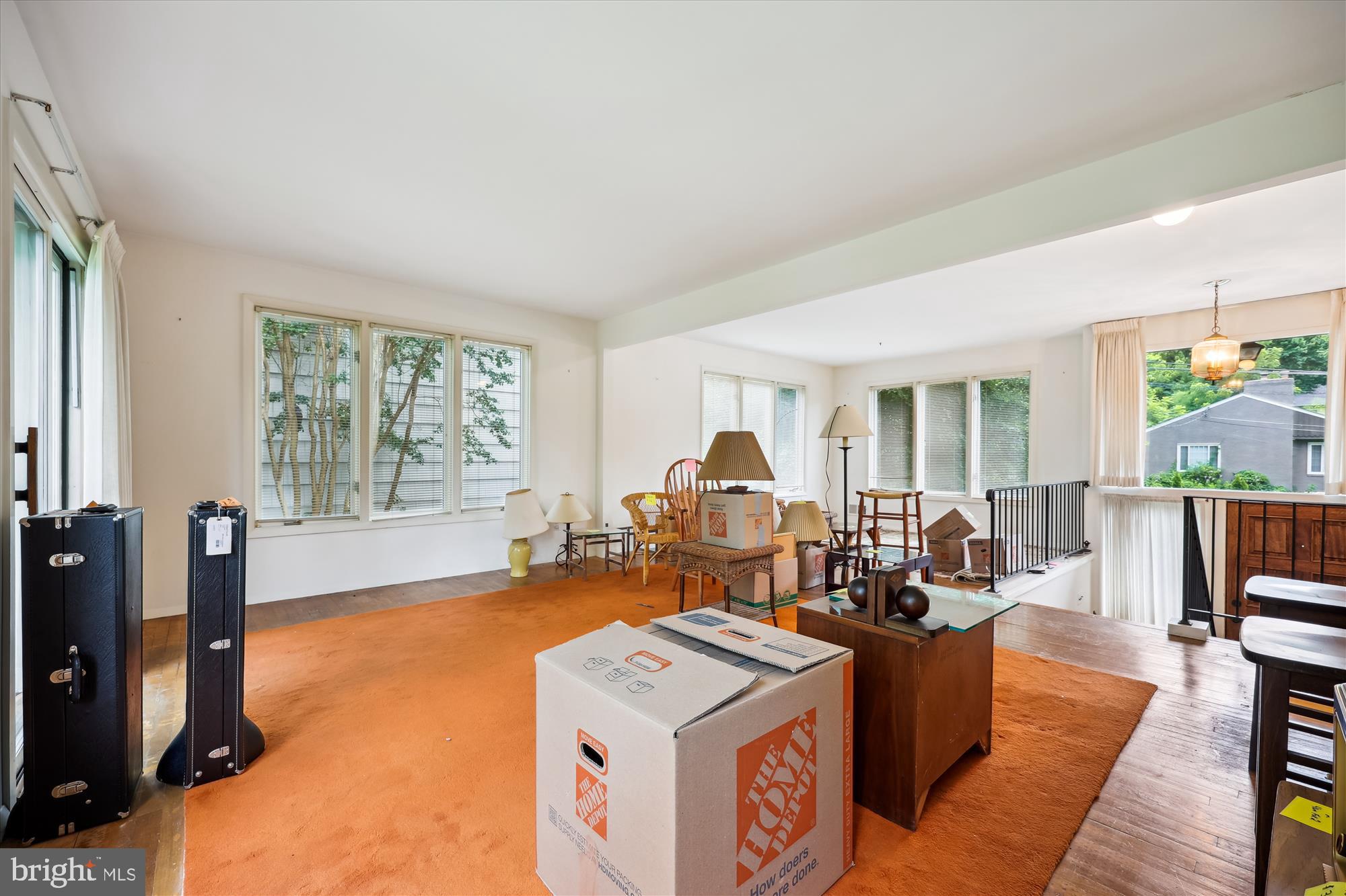 10205 Capitol View Avenue Silver Spring, MD 20910 - Photo 6 of 27 a living room with furniture a flat screen tv and a large window
