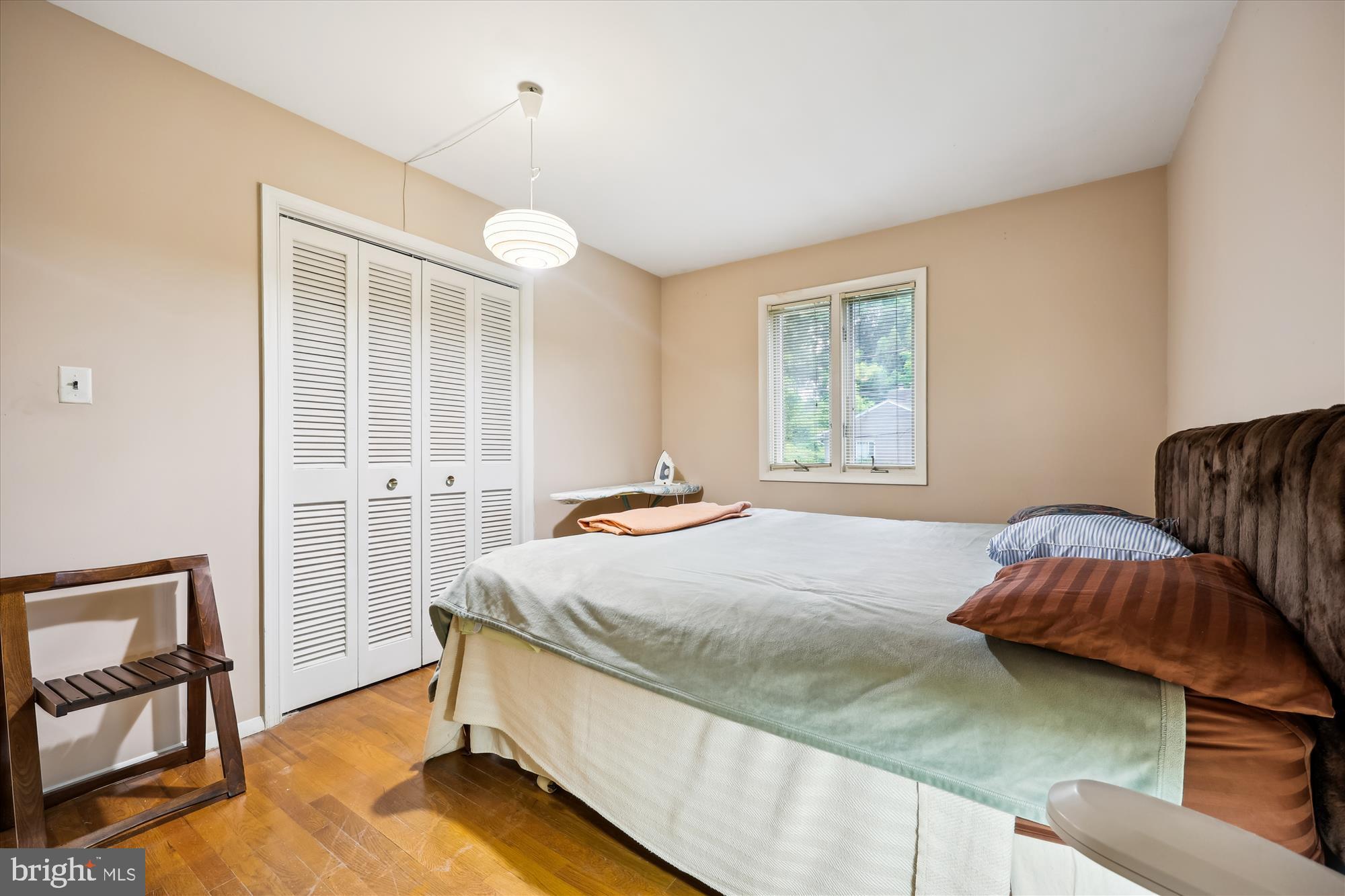 10205 Capitol View Avenue Silver Spring, MD 20910 - Photo 9 of 27 a bed room with a bed and a chair