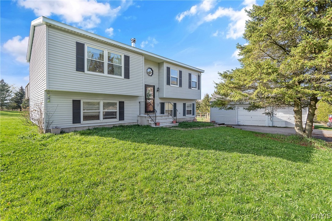 Front of home showing the large 2 car detached gar