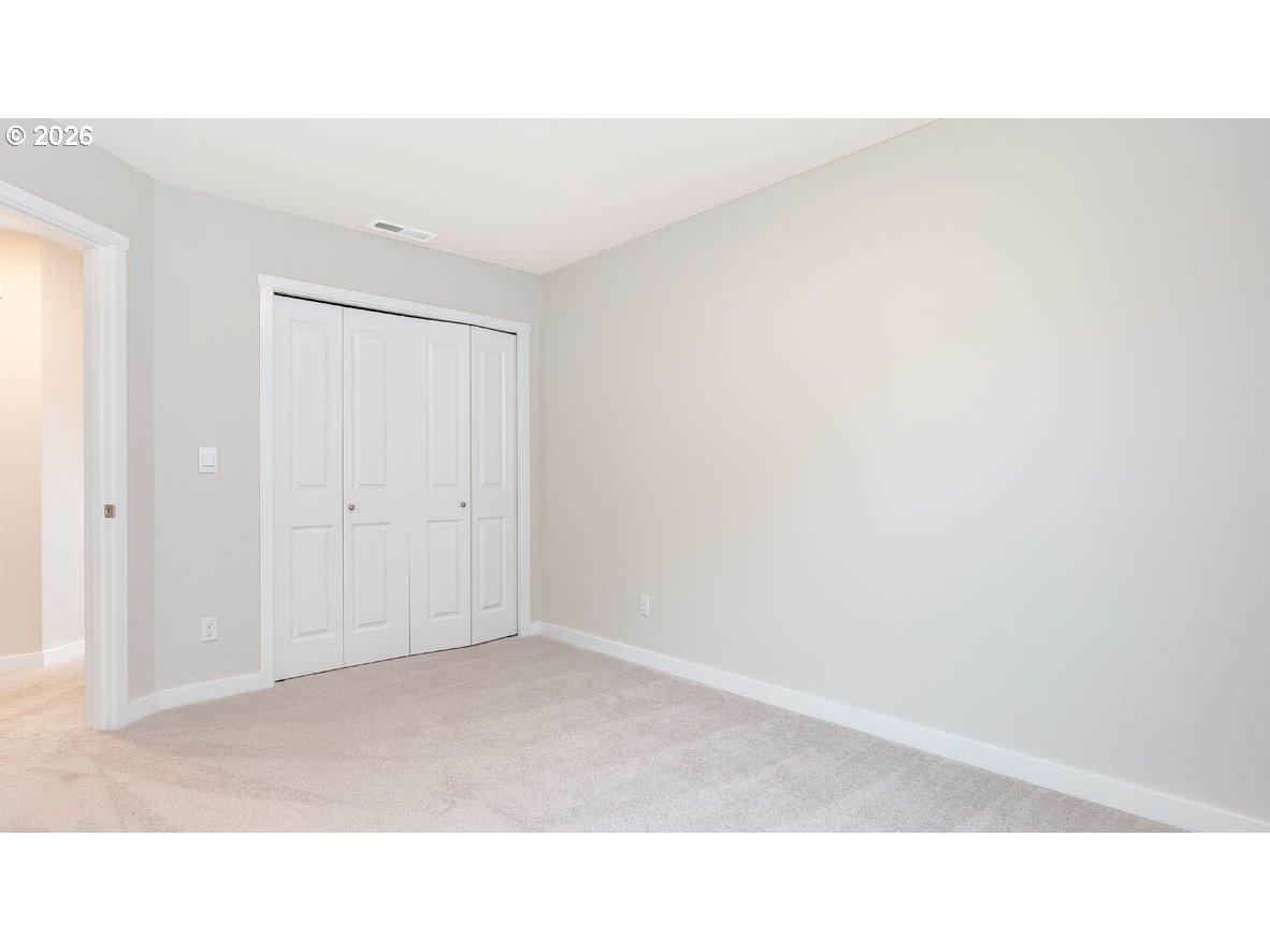 9194 Southeast Azalea Street Happy Valley, OR 97086 - Photo 22 of 32 a open hall with a bench