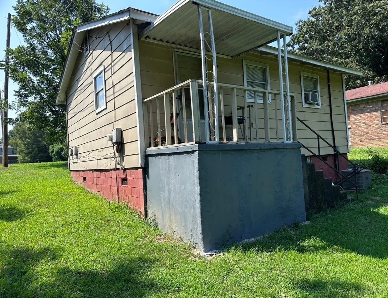 3368 Old Horn Lake Road Memphis, TN 38109 - Photo 2 of 3 a view of a house with a yard and potted plants