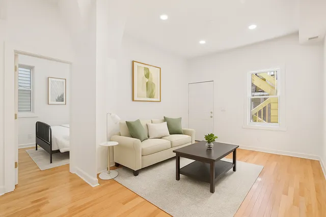 a living room with furniture and a rug