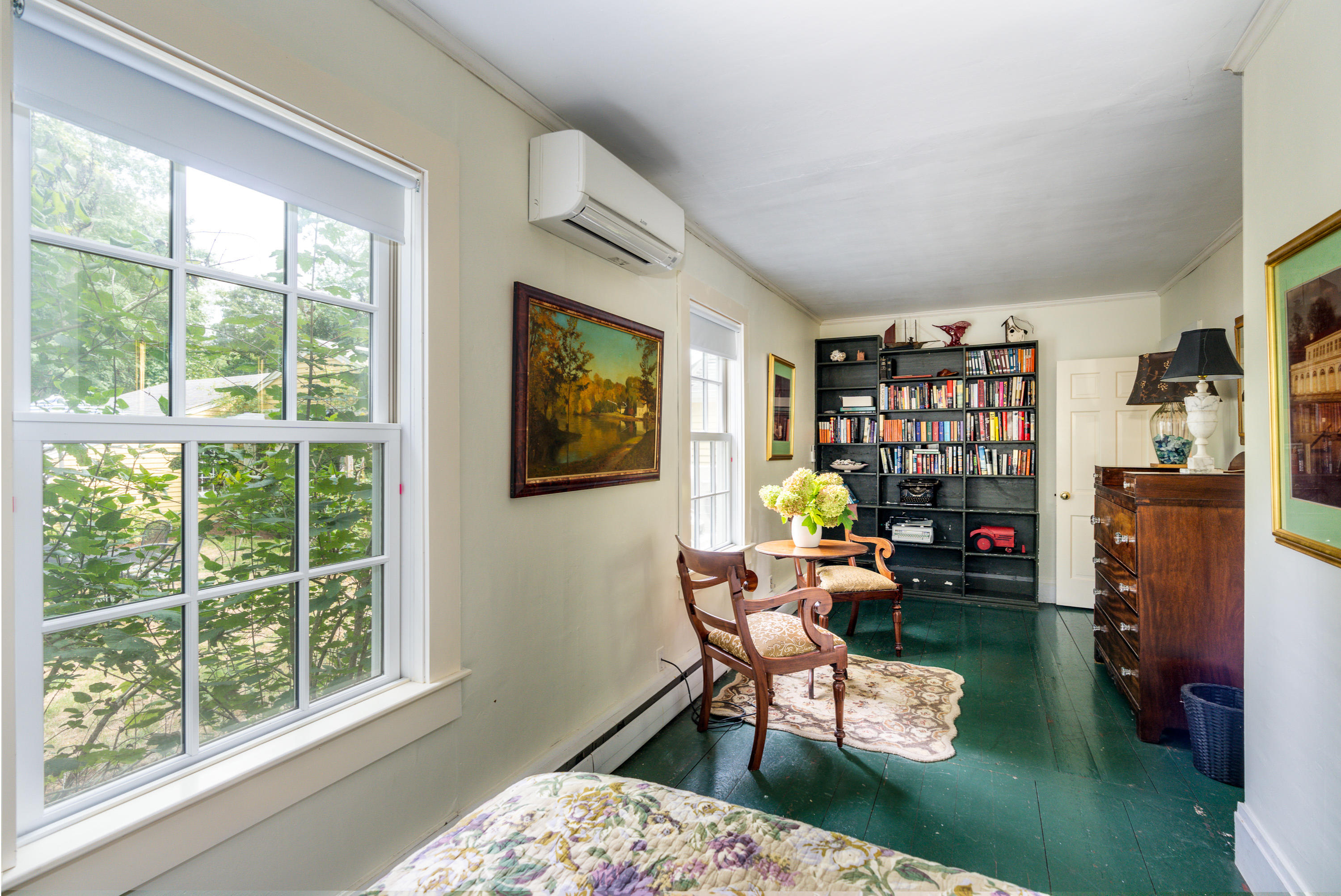 120 Bridge Road Eastham, MA 02642 - Photo 14 of 48 a living room with furniture a bookshelf and a window