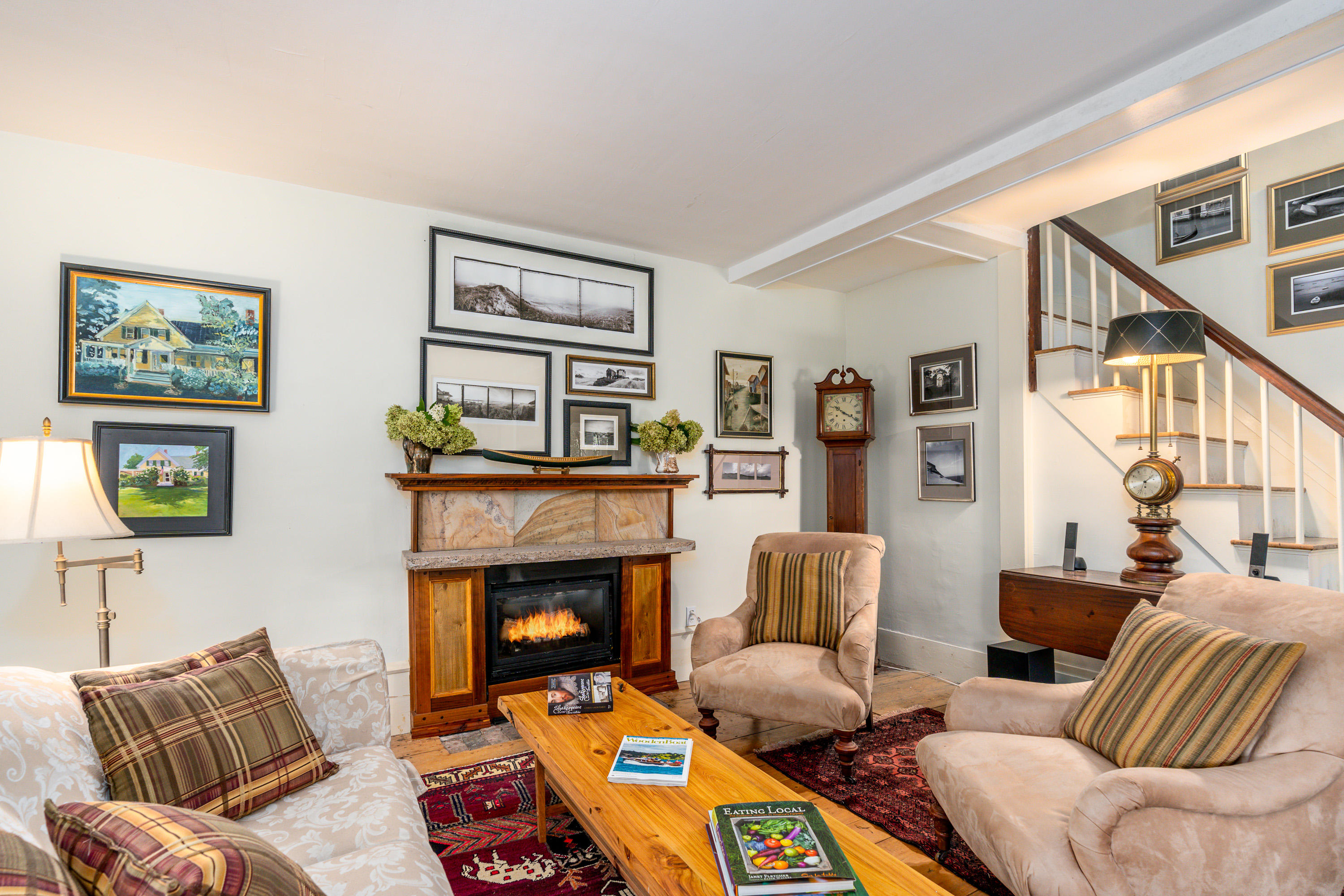 120 Bridge Road Eastham, MA 02642 - Photo 18 of 48 a living room with furniture and a fireplace