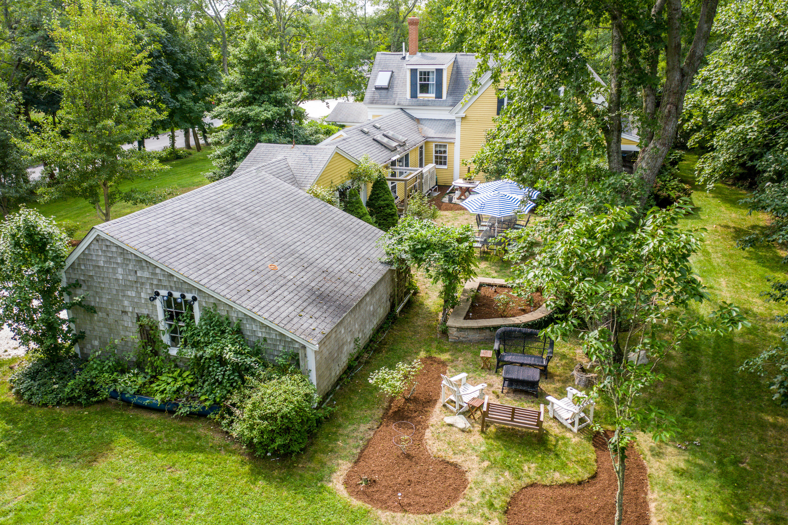 120 Bridge Road Eastham, MA 02642 - Photo 27 of 48 a view of a house with a yard and sitting area