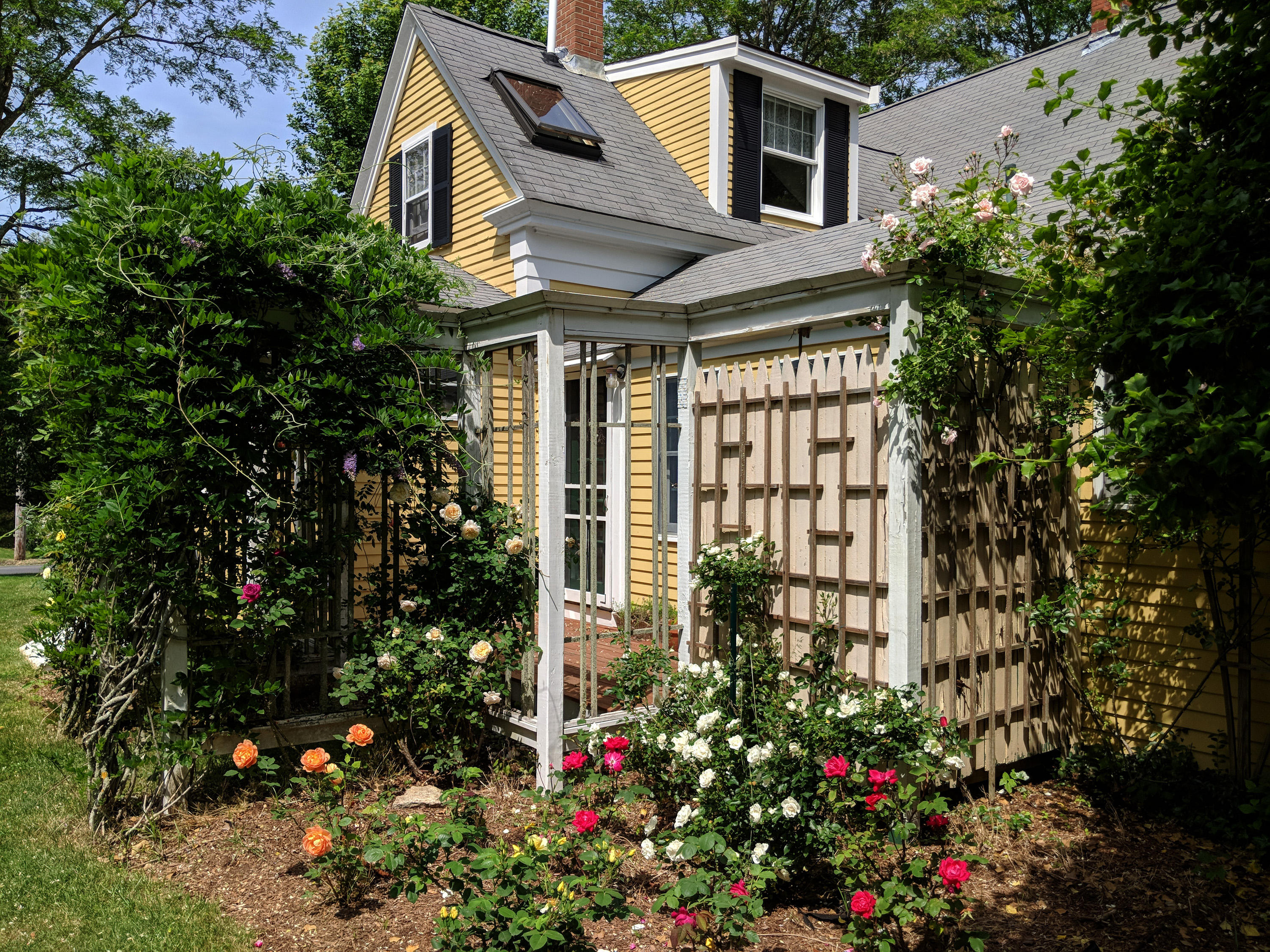 120 Bridge Road Eastham, MA 02642 - Photo 30 of 48 a view of a house that has a flower garden