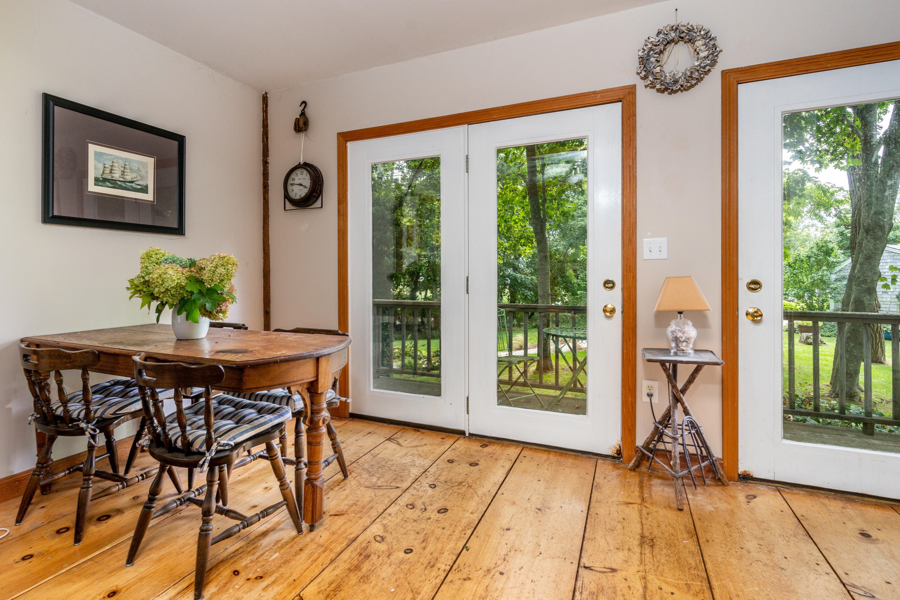 120 Bridge Road Eastham, MA 02642 - Photo 40 of 48 a dining room with furniture and large windows