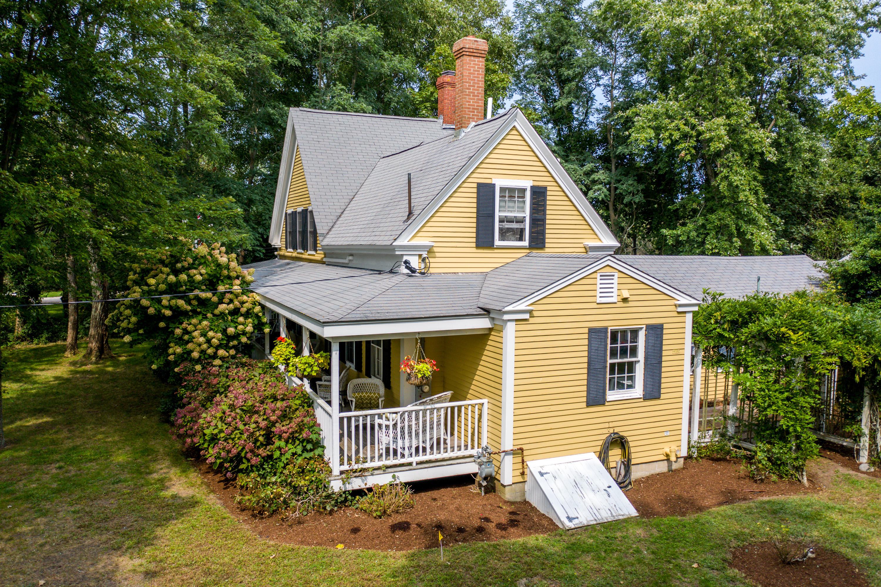 120 Bridge Road Eastham, MA 02642 - Photo 4 of 48 a view of a house with a yard and plants