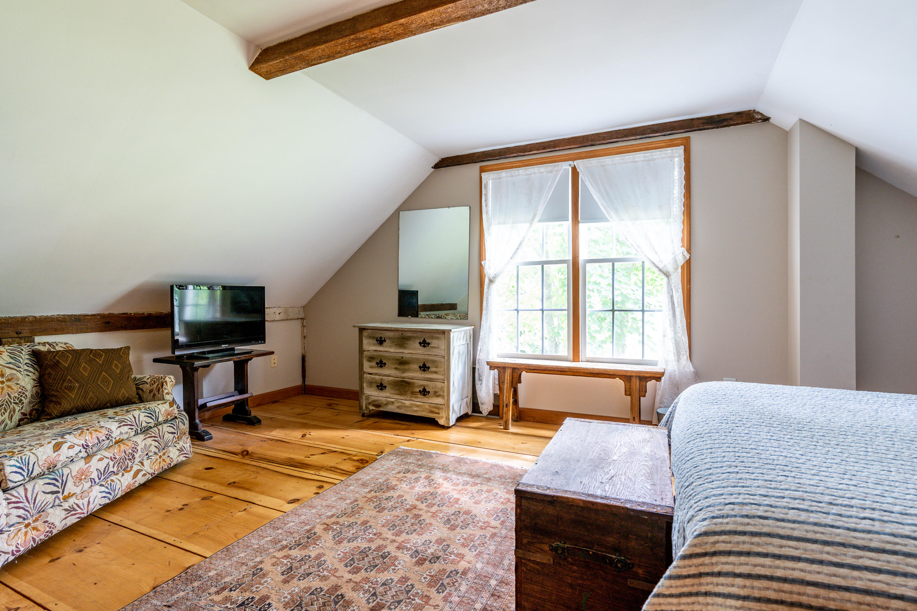 120 Bridge Road Eastham, MA 02642 - Photo 41 of 48 a bedroom with a bed a television and a large window