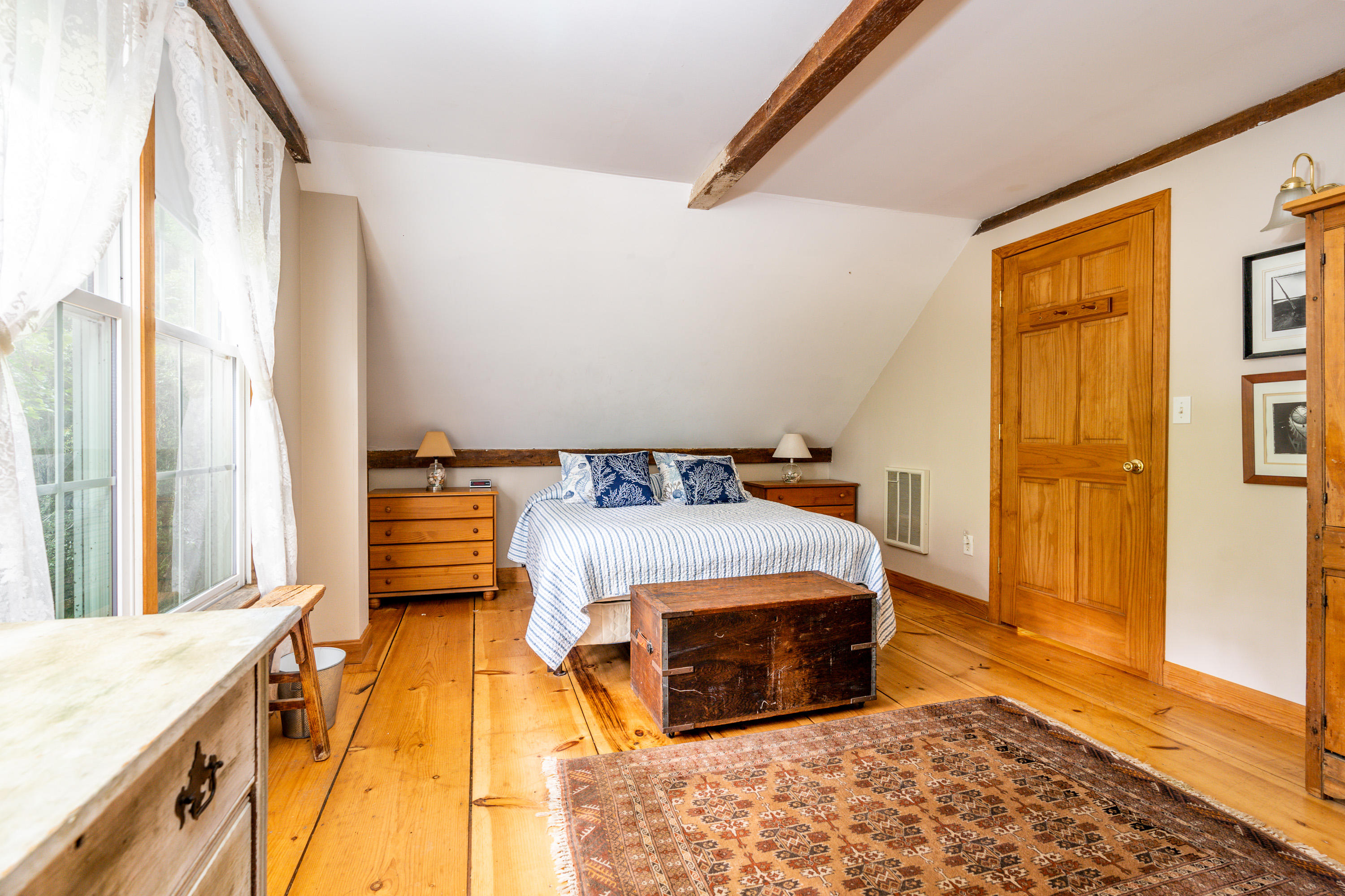 120 Bridge Road Eastham, MA 02642 - Photo 42 of 48 a bedroom with a bed and wooden floor