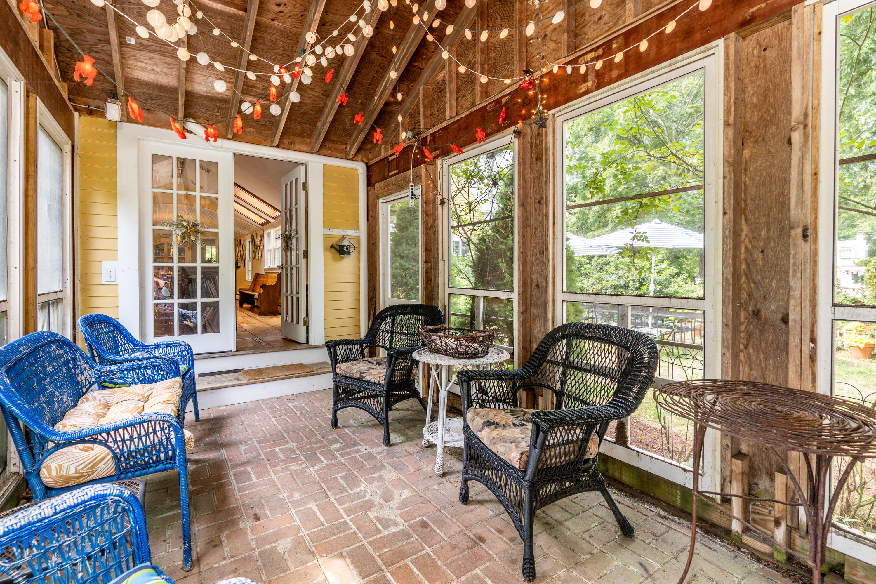 120 Bridge Road Eastham, MA 02642 - Photo 6 of 48 a living room with furniture and floor to ceiling windows