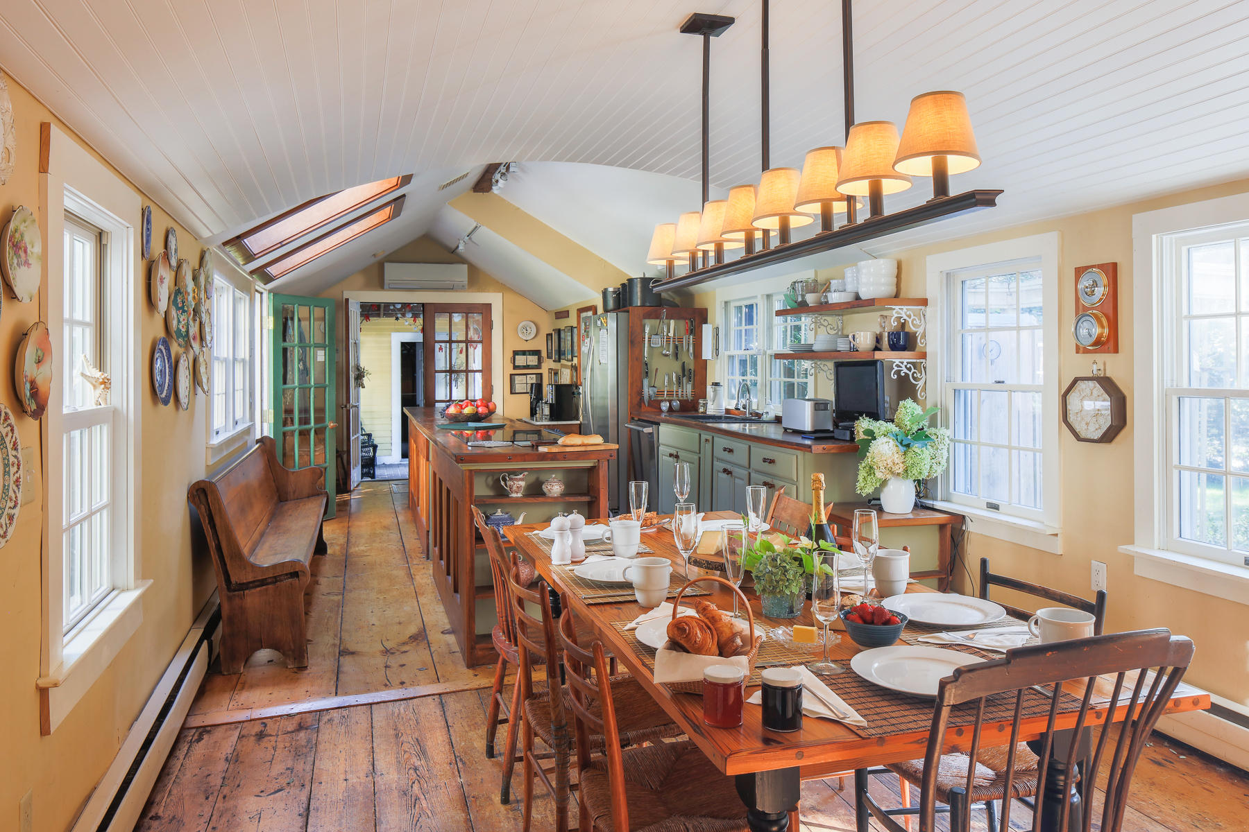 120 Bridge Road Eastham, MA 02642 - Photo 8 of 48 a view of a dining room with furniture window and wooden floor