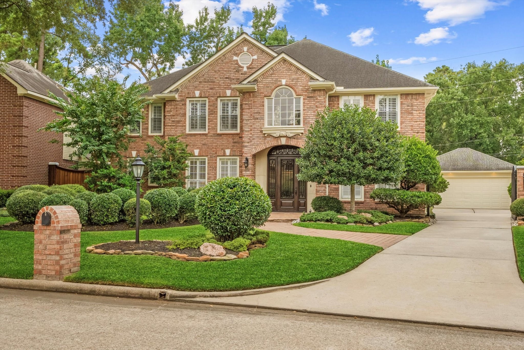 19309 Dianeshire Drive Spring, TX 77388 - Photo 3 of 33 a front view of a house with a yard and potted plants