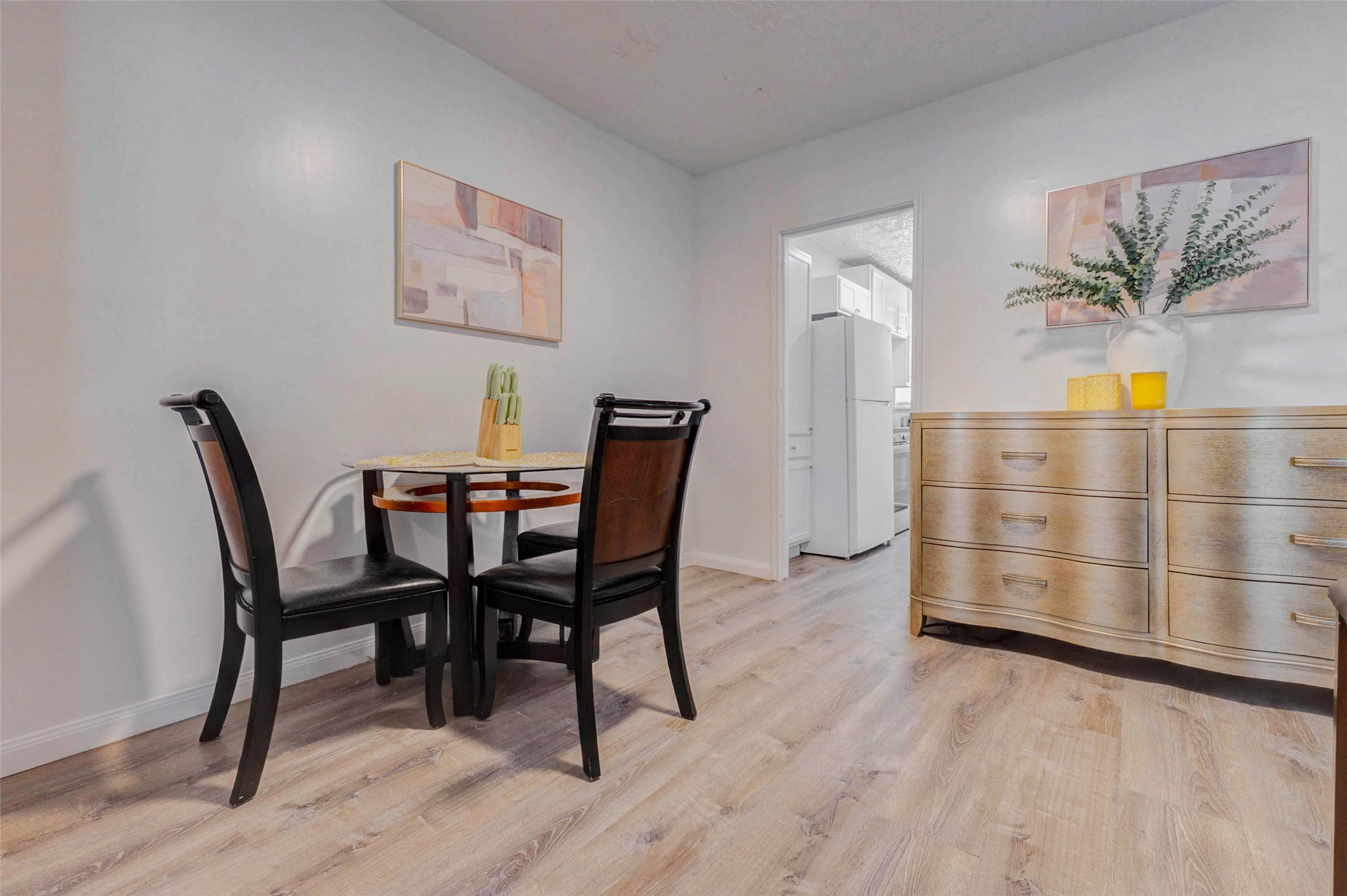 2902 Truxillo Street Houston, TX 77004 - Photo 13 of 32 a view of a dining room with furniture and wooden floor