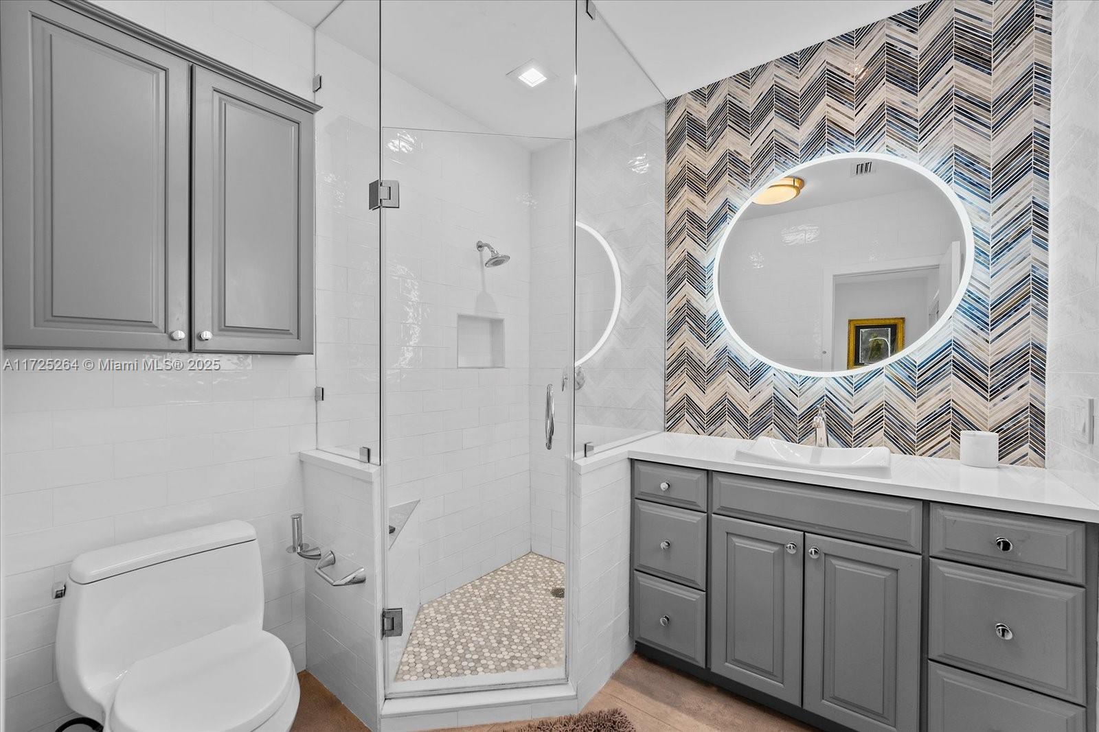 2104 Northeast 124th Street North Miami, FL 33181 - Photo 14 of 26 a bathroom with a toilet and a sink