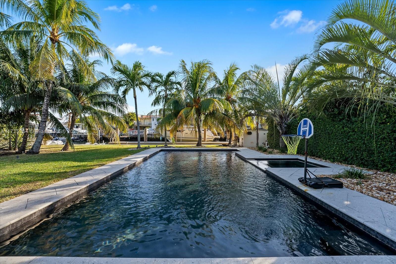 2104 Northeast 124th Street North Miami, FL 33181 - Photo 18 of 26 a view of a backyard with swimming pool