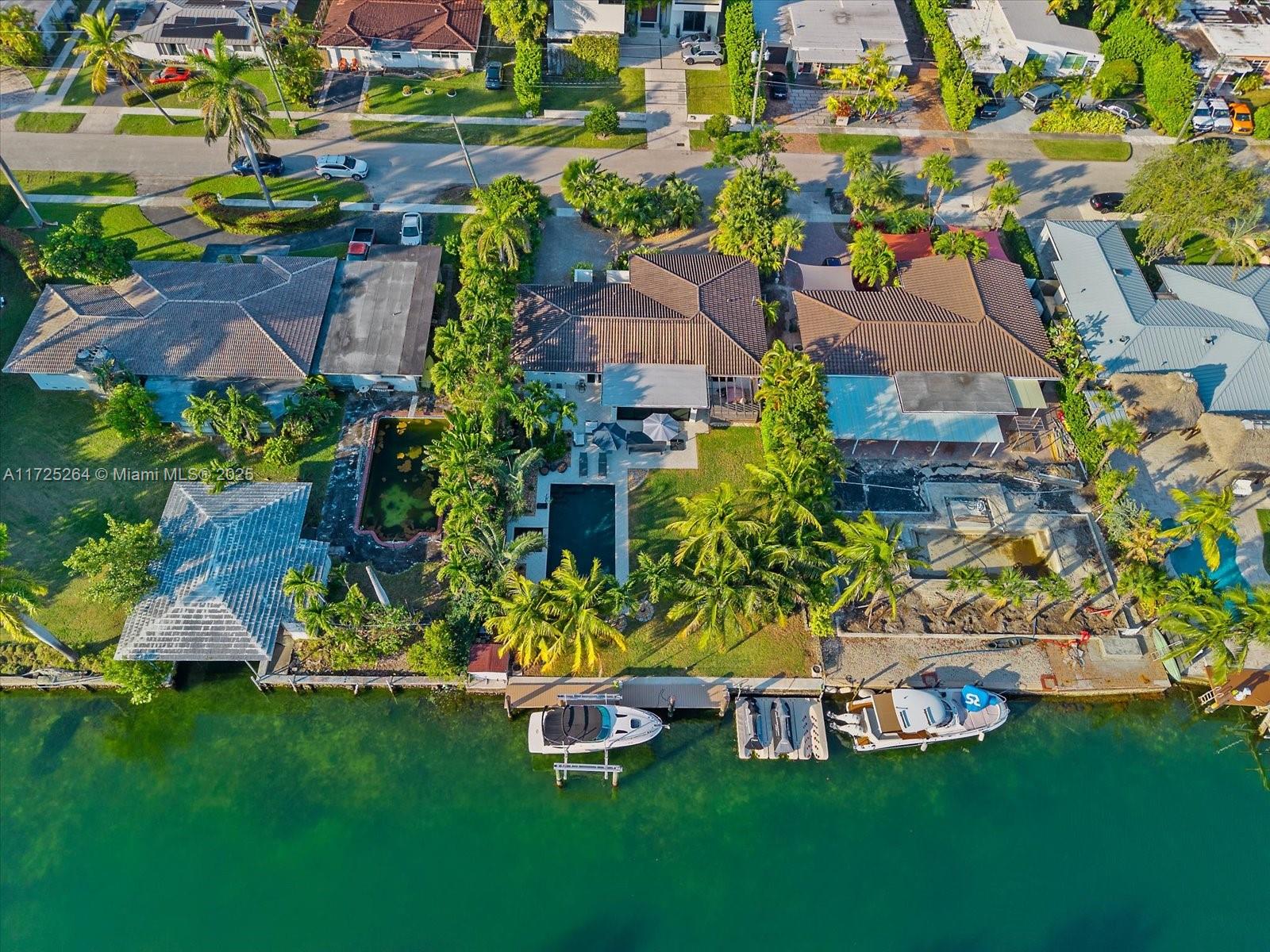 2104 Northeast 124th Street North Miami, FL 33181 - Photo 21 of 26 an aerial view of a house with a garden