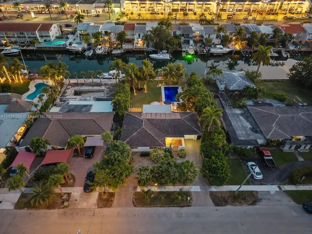 an aerial view of residential building and ocean