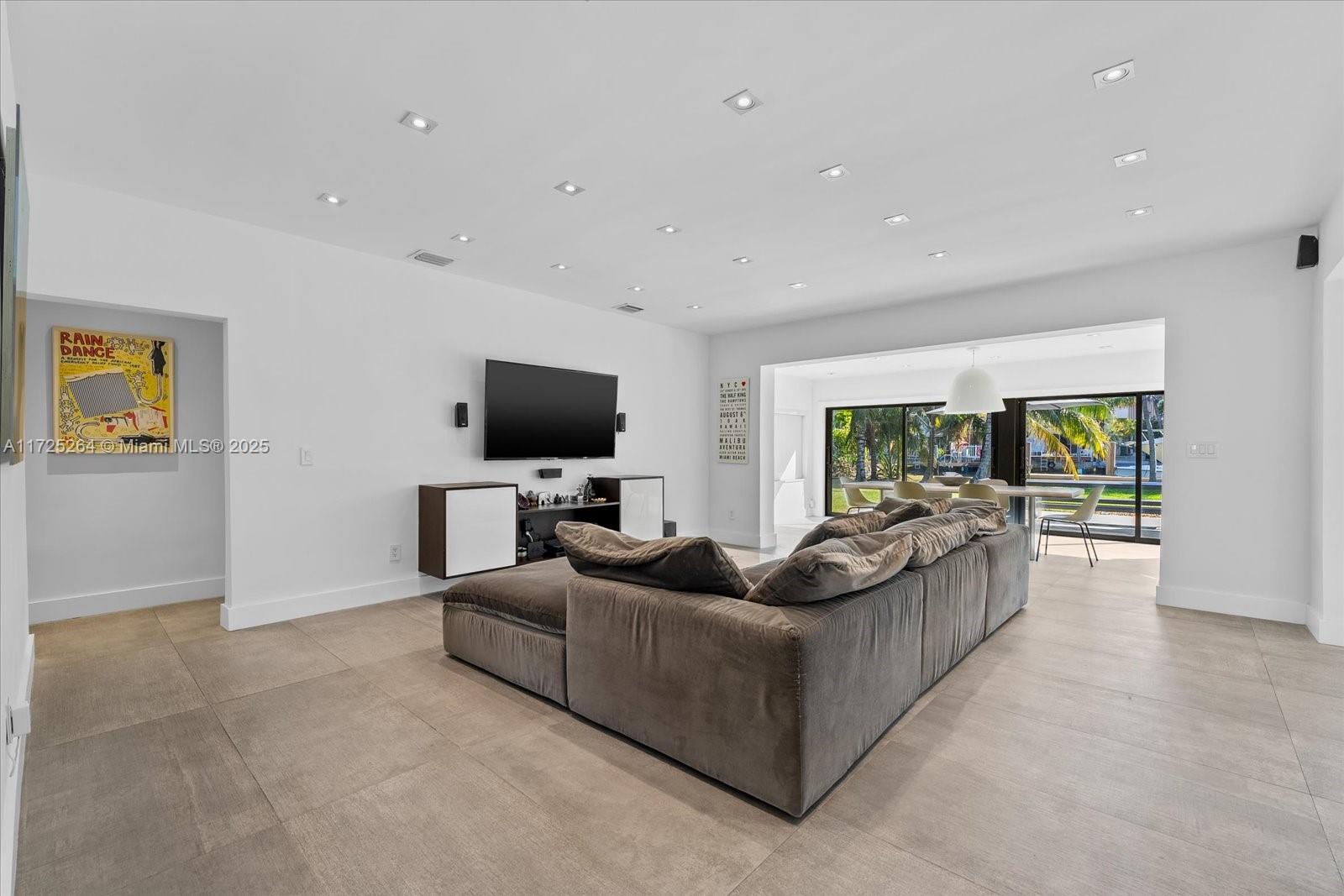 2104 Northeast 124th Street North Miami, FL 33181 - Photo 4 of 26 a living room with furniture and a flat screen tv
