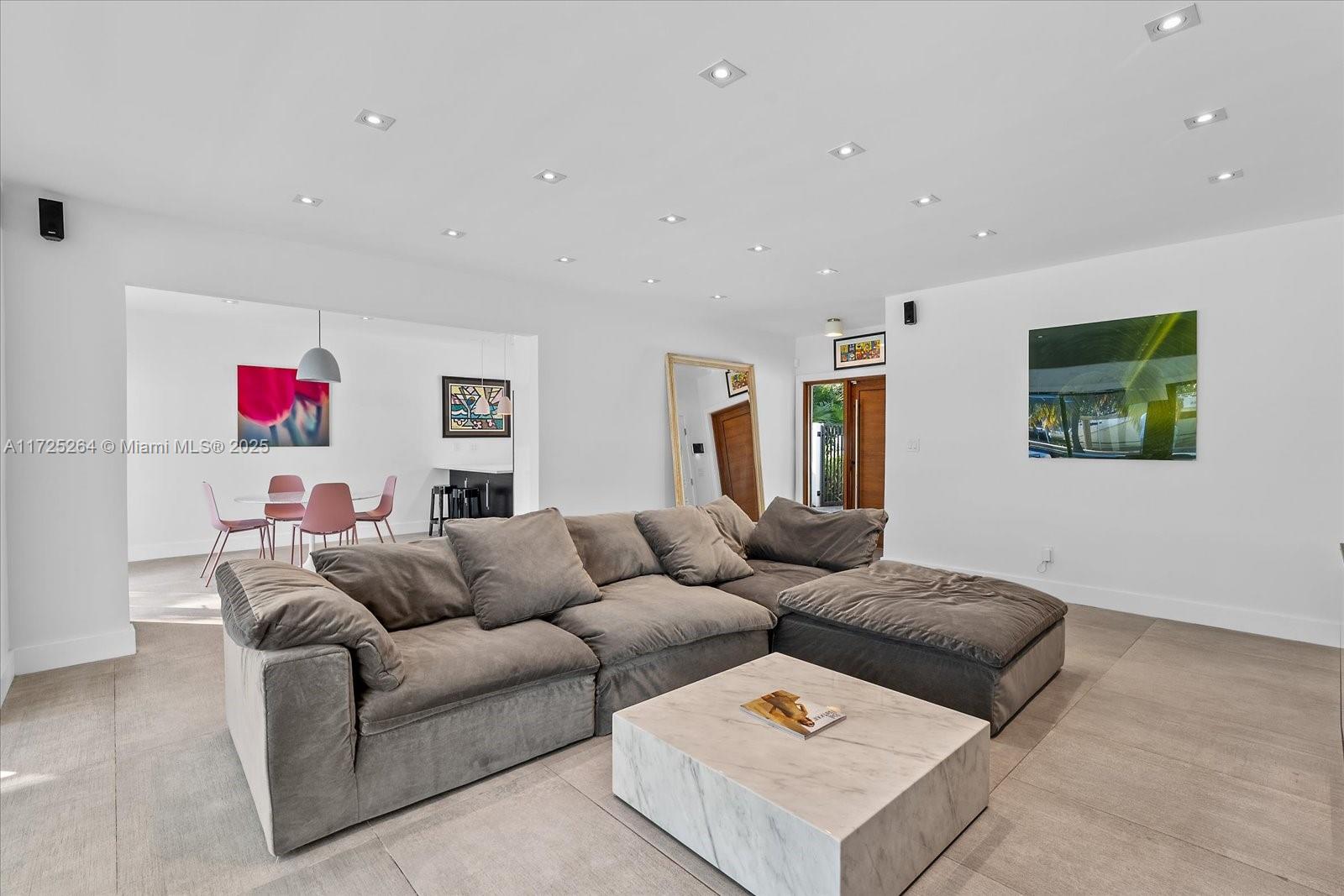 2104 Northeast 124th Street North Miami, FL 33181 - Photo 5 of 26 a living room with furniture and a flat screen tv