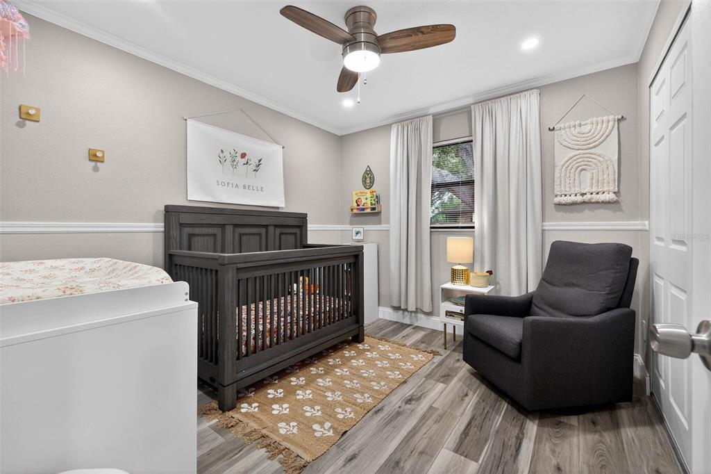 6501 Livingston Avenue North St. Petersburg, FL 33702 - Photo 16 of 31 a bedroom with furniture and a window