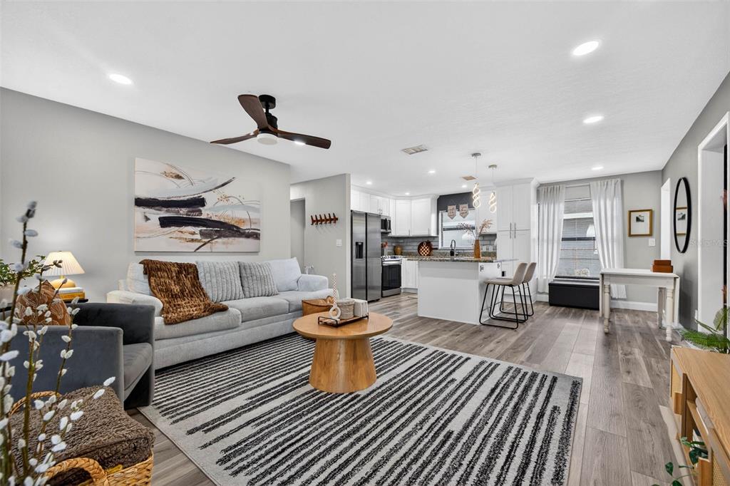 6501 Livingston Avenue North St. Petersburg, FL 33702 - Photo 2 of 31 a living room with furniture and kitchen view