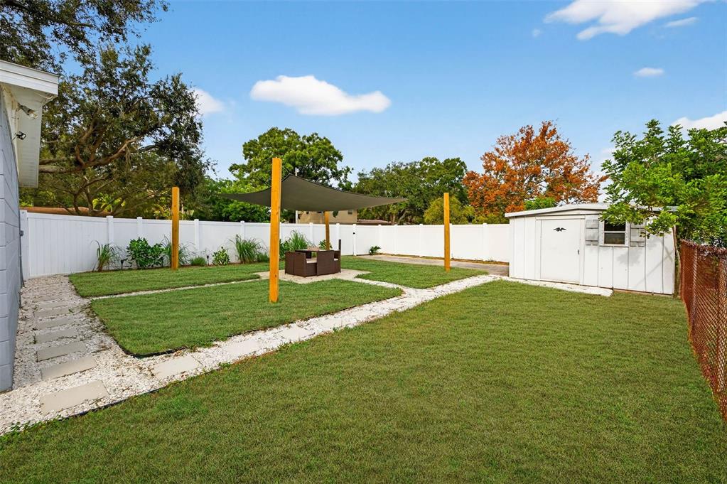 6501 Livingston Avenue North St. Petersburg, FL 33702 - Photo 24 of 31 a view of a house with a big yard