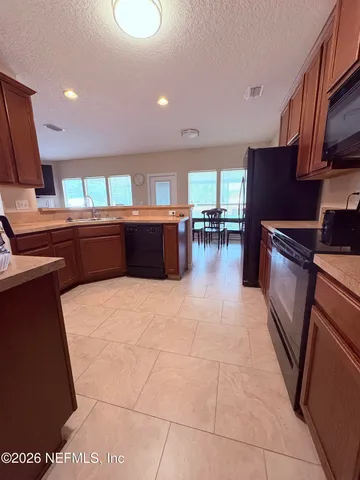 a kitchen with lots of counter top space and appliances