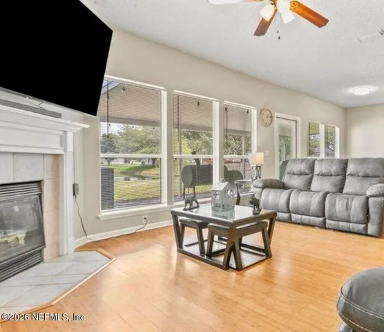 a living room with furniture and a fireplace