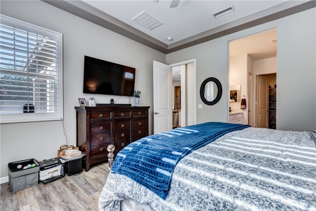 11137 Briar Rose Court Corona, CA 92883 - Photo 28 of 75 a bedroom with a bed and a flat screen tv