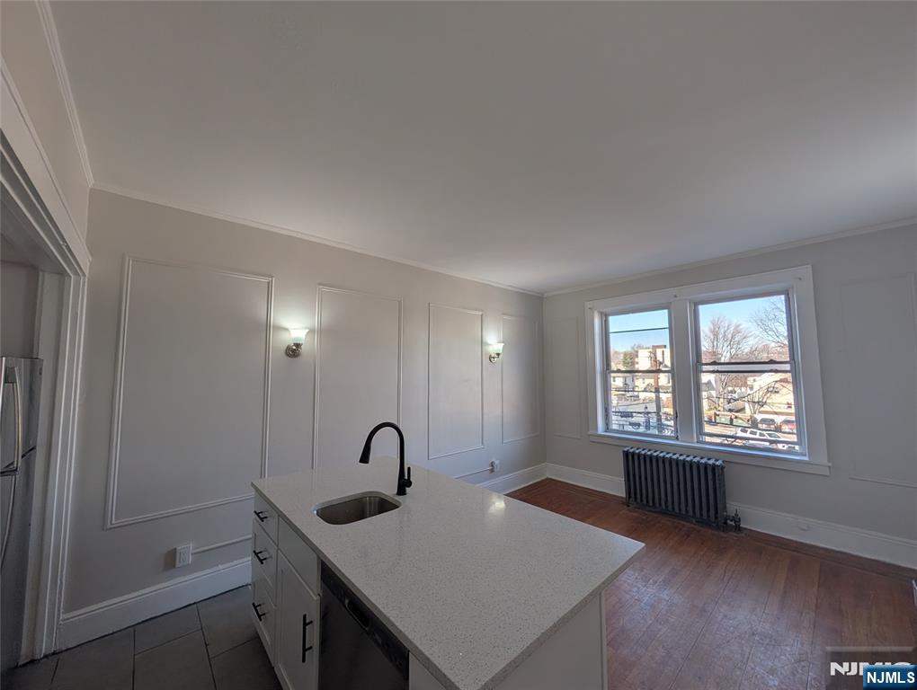 85 Anderson Street, Unit C6 Hackensack, NJ 07601 - Photo 5 of 10 a view of a room that has a window and wooden floor