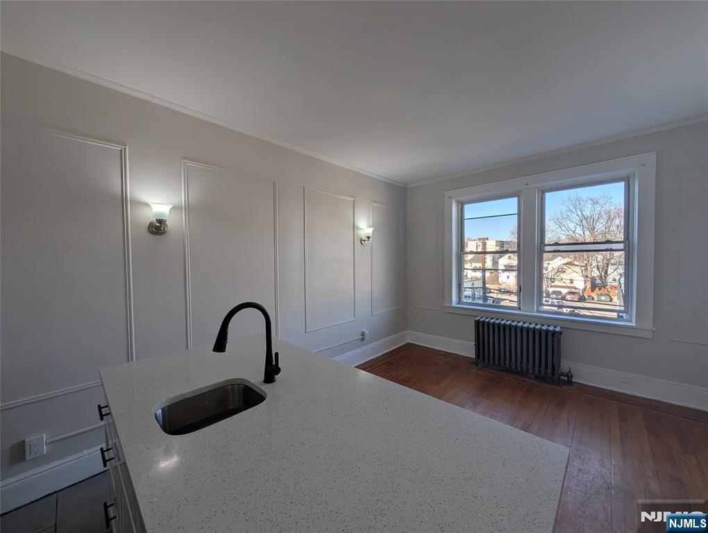 85 Anderson Street, Unit C6 Hackensack, NJ 07601 - Photo 7 of 10 a bedroom with a bed and a window