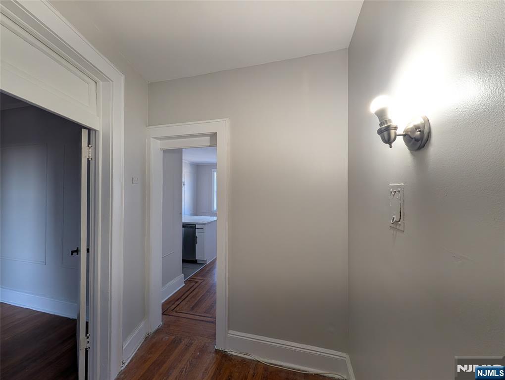 85 Anderson Street, Unit C6 Hackensack, NJ 07601 - Photo 10 of 10 a view of a hallway with wooden floor