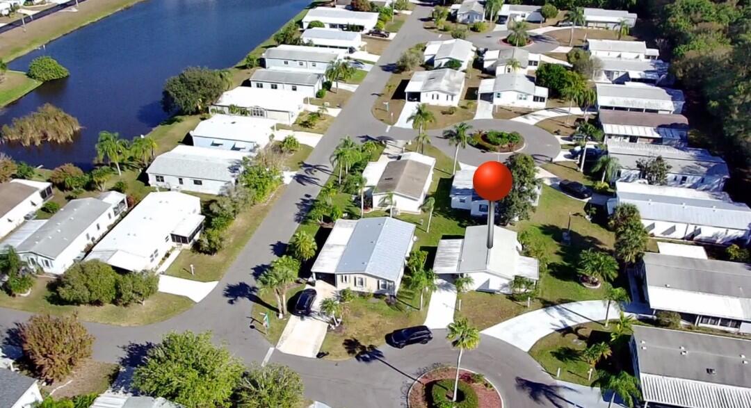 an aerial view of multiple houses with yard