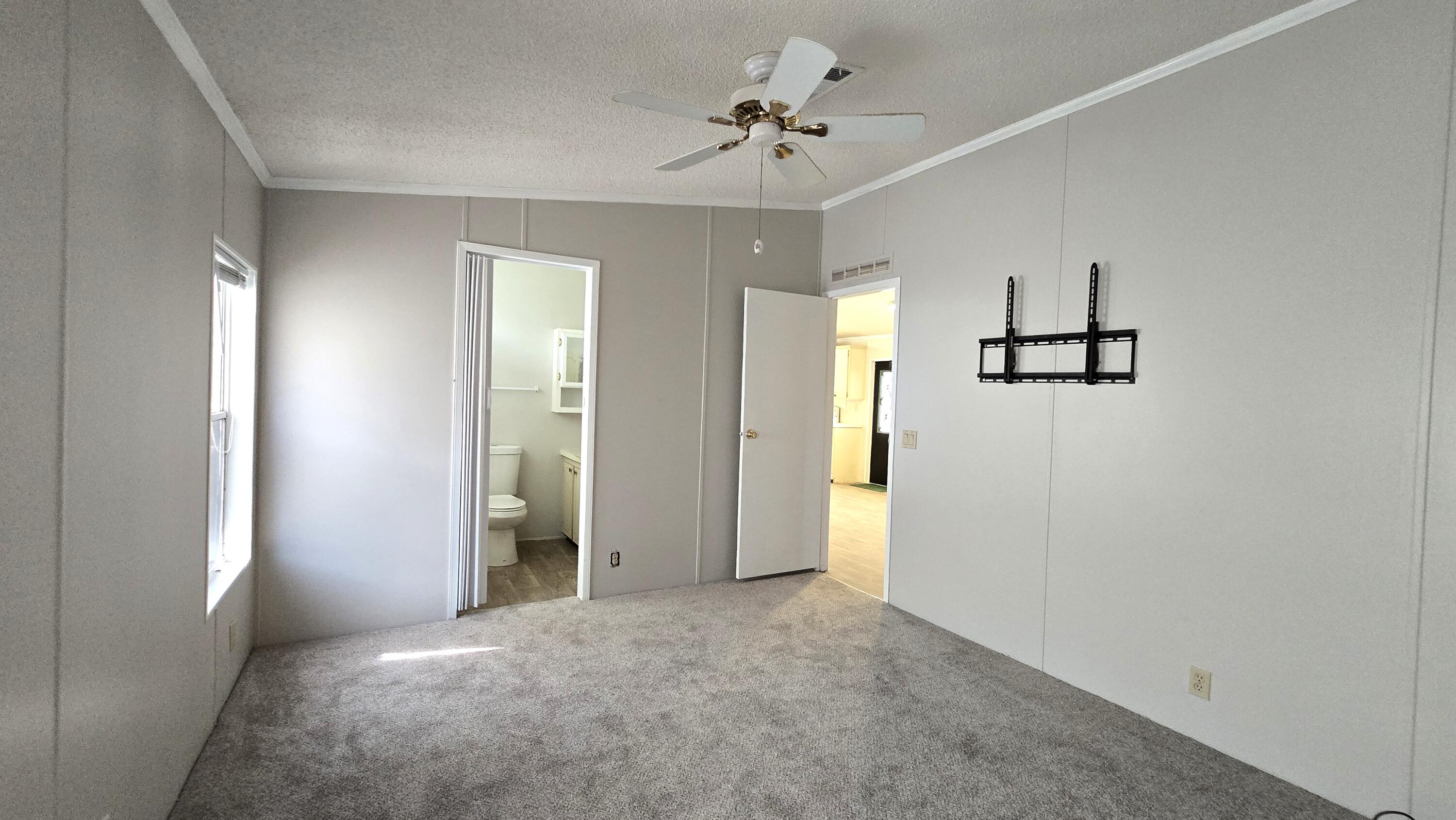 5680 Hemingway Court, Unit 15 Fort Pierce, FL 34982 - Photo 11 of 18 a view of a big room with closet and windows