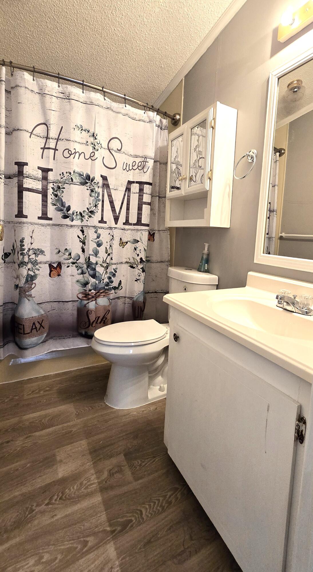 5680 Hemingway Court, Unit 15 Fort Pierce, FL 34982 - Photo 14 of 18 a bathroom with a sink toilet and shower