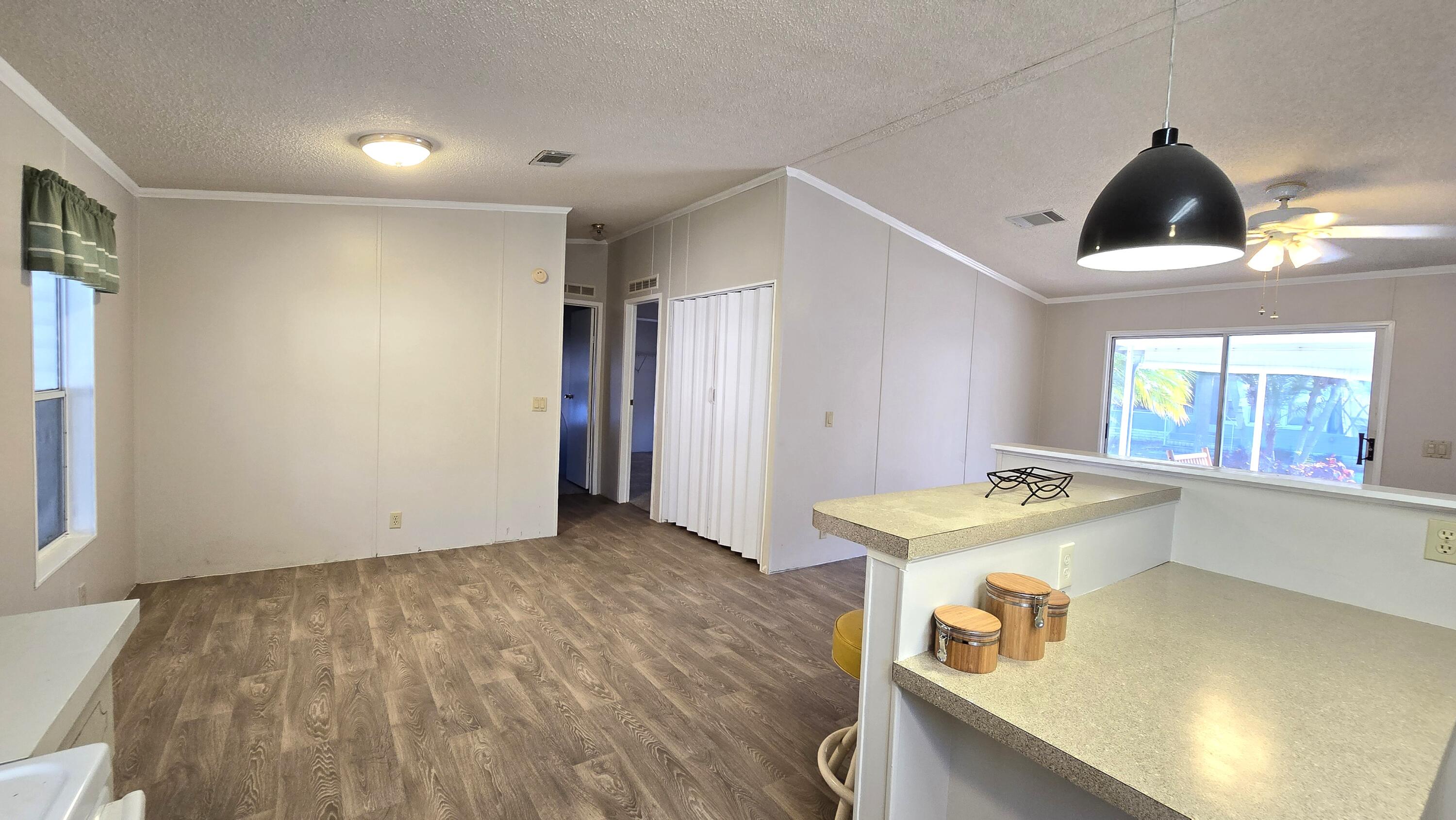 5680 Hemingway Court, Unit 15 Fort Pierce, FL 34982 - Photo 8 of 18 a room with storage and utility