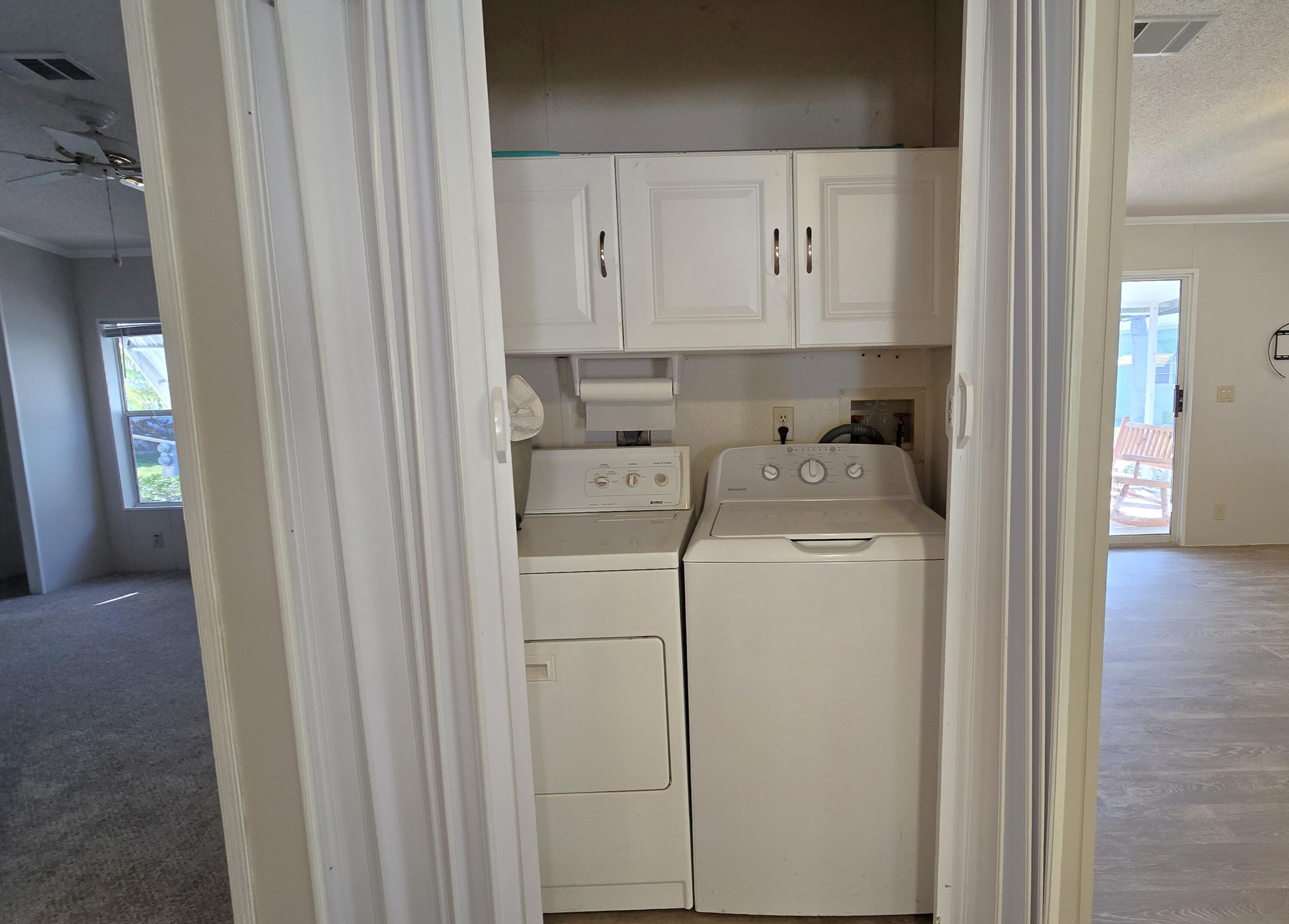 5680 Hemingway Court, Unit 15 Fort Pierce, FL 34982 - Photo 10 of 18 a utility room with dryer and washer