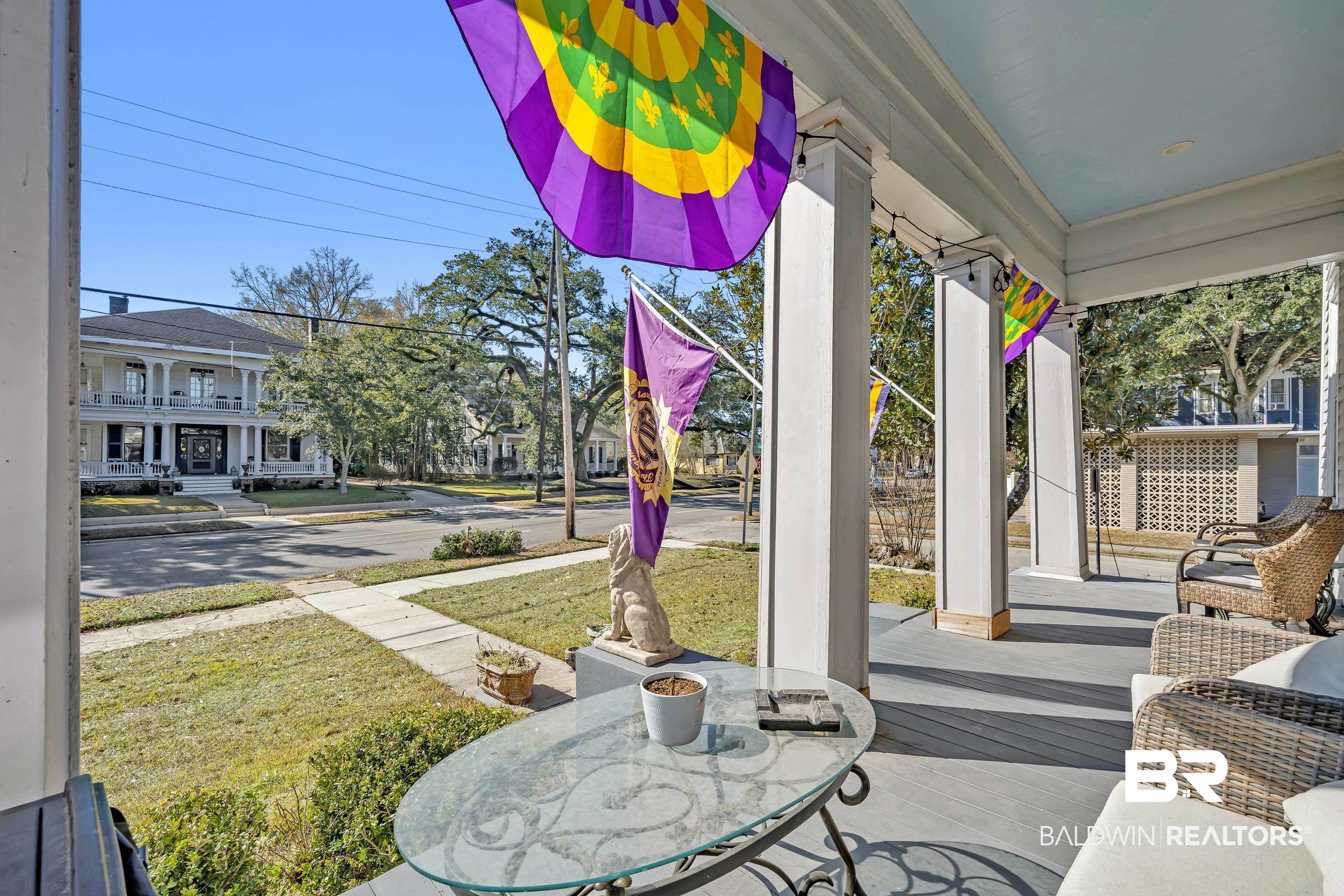 1322 Dauphin Street Mobile, AL 36604 - Photo 3 of 21 Covered porch with a lawn and outdoor dining space