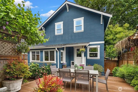 a backyard of a house with yard barbeque oven and outdoor seating