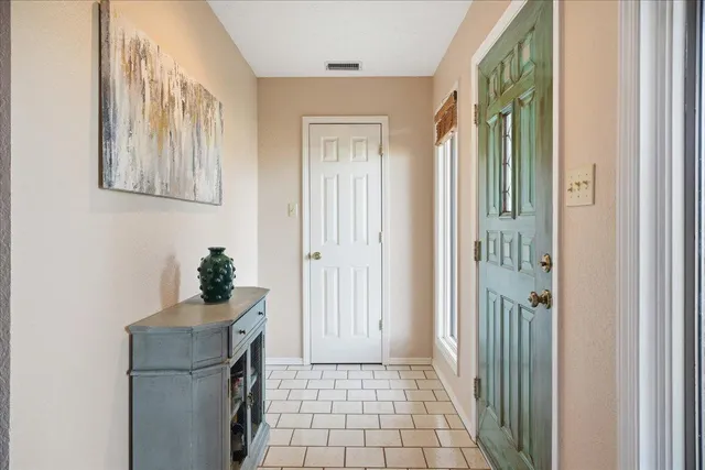 a room that has a mirror and a wooden floor