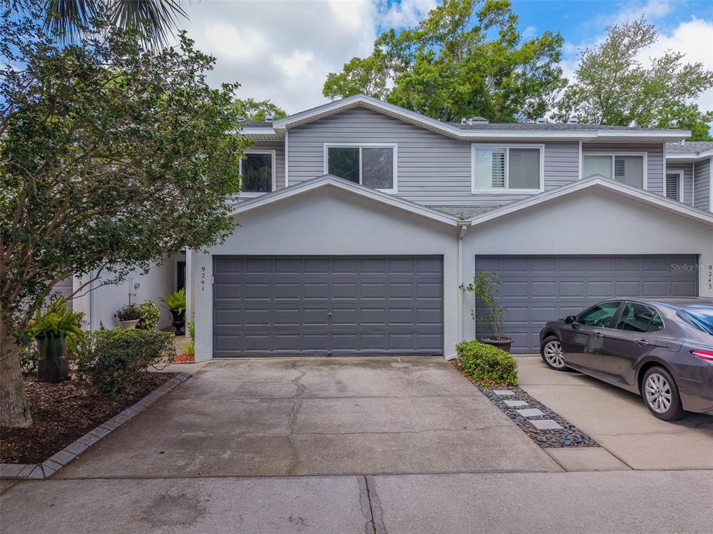 9241 Jake's Path Largo, FL 33771 - Photo 1 of 46 a car parked in front of a house