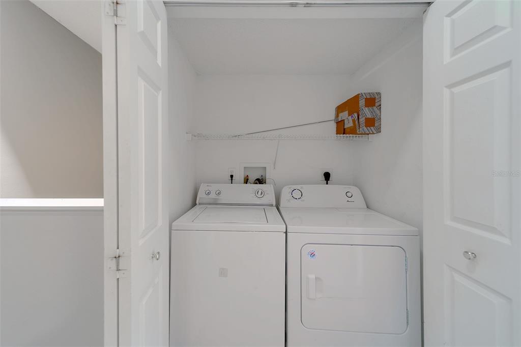 9241 Jake's Path Largo, FL 33771 - Photo 18 of 46 a utility room with dryer and washer
