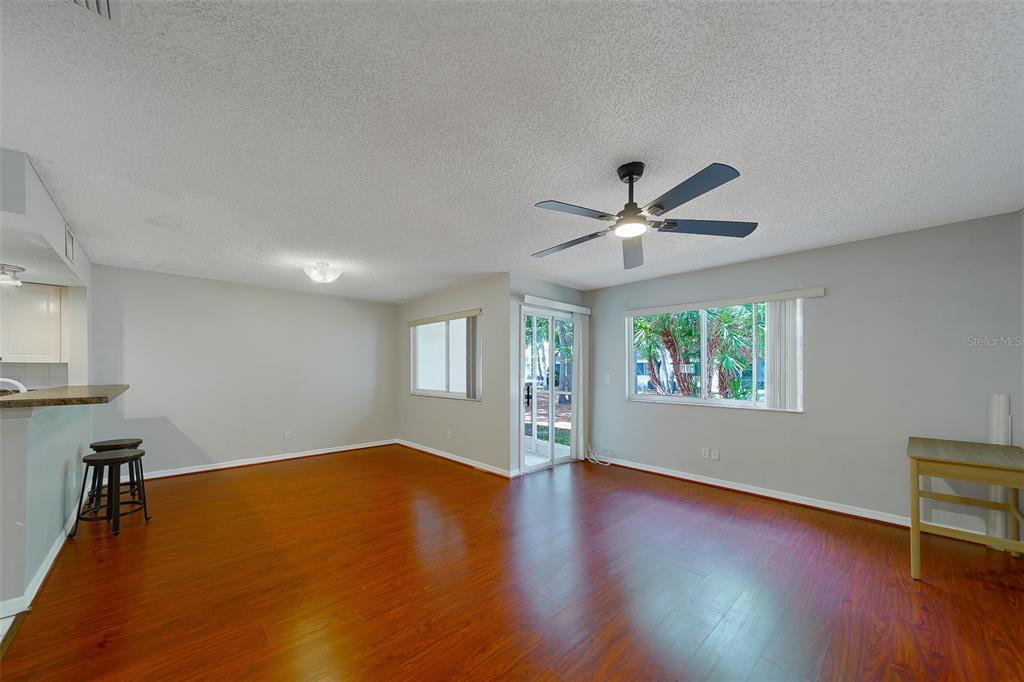 9241 Jake's Path Largo, FL 33771 - Photo 24 of 46 wooden floor in an empty room with a window