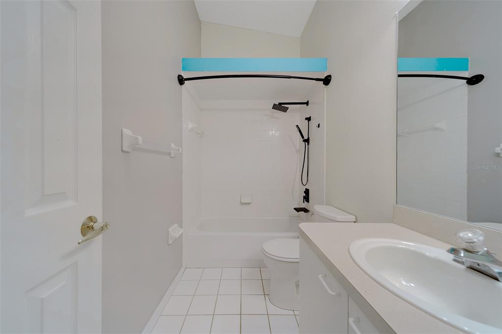 9241 Jake's Path Largo, FL 33771 - Photo 10 of 46 a bathroom with a sink a toilet and shower